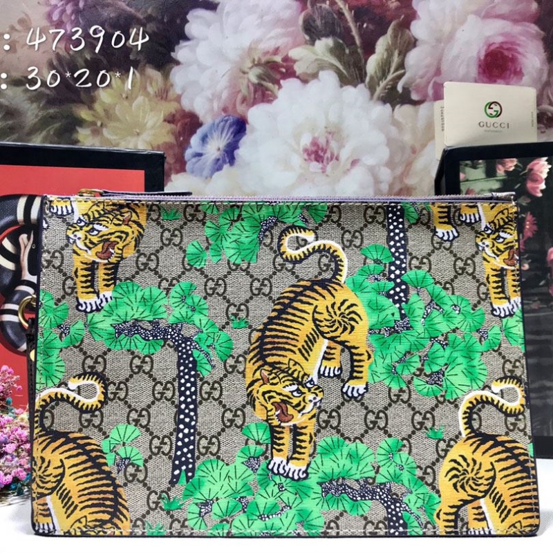G*u*i clutch bags